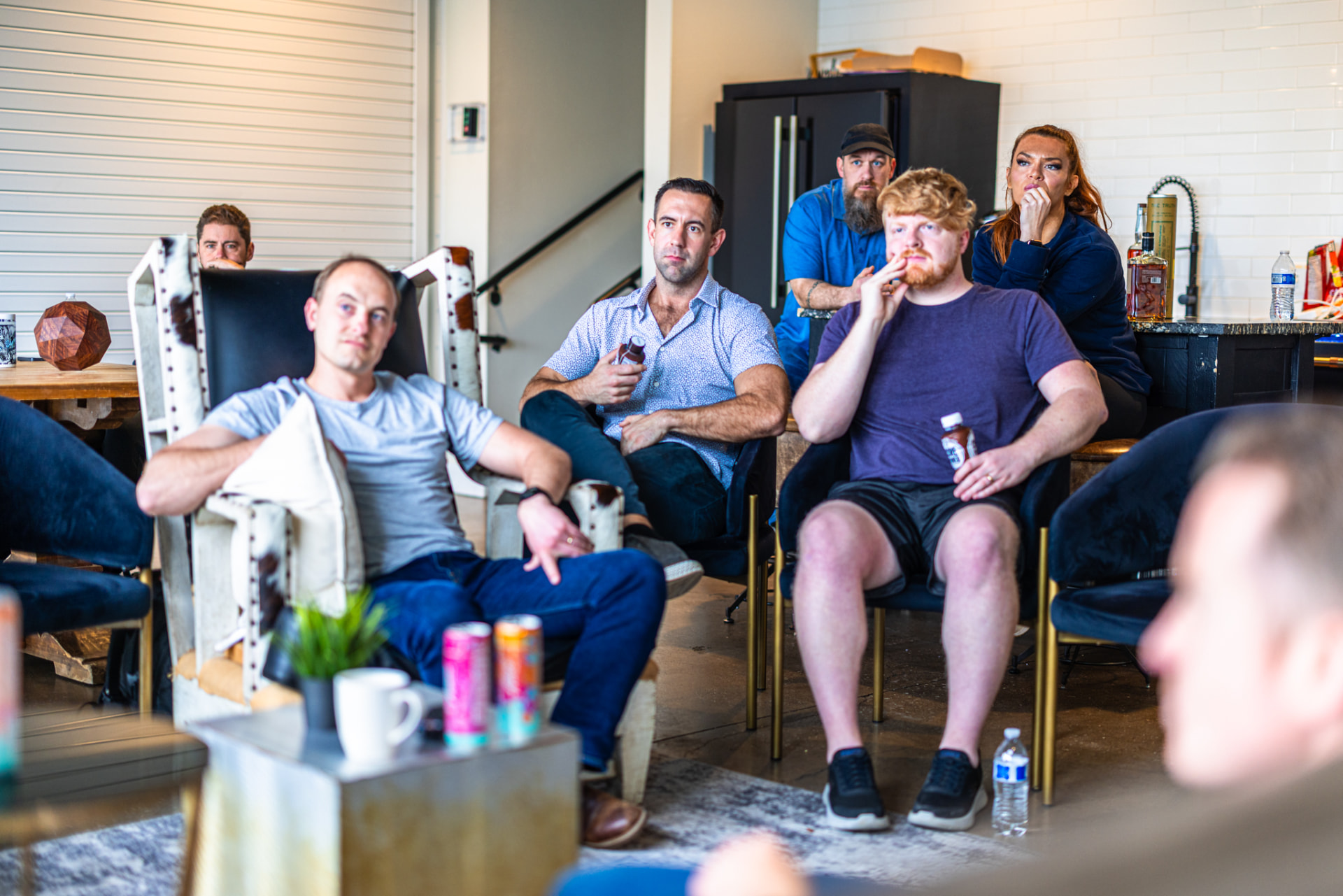 The group listening through a session in the lounge