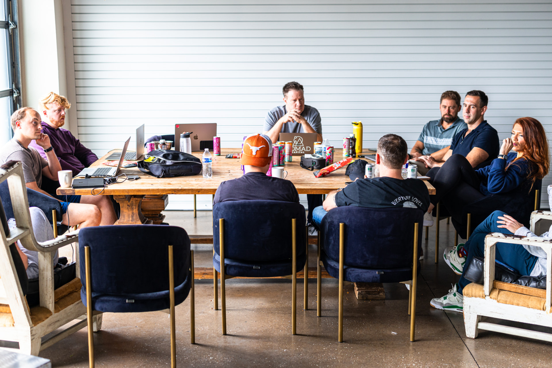 Working session with laptops around the big table