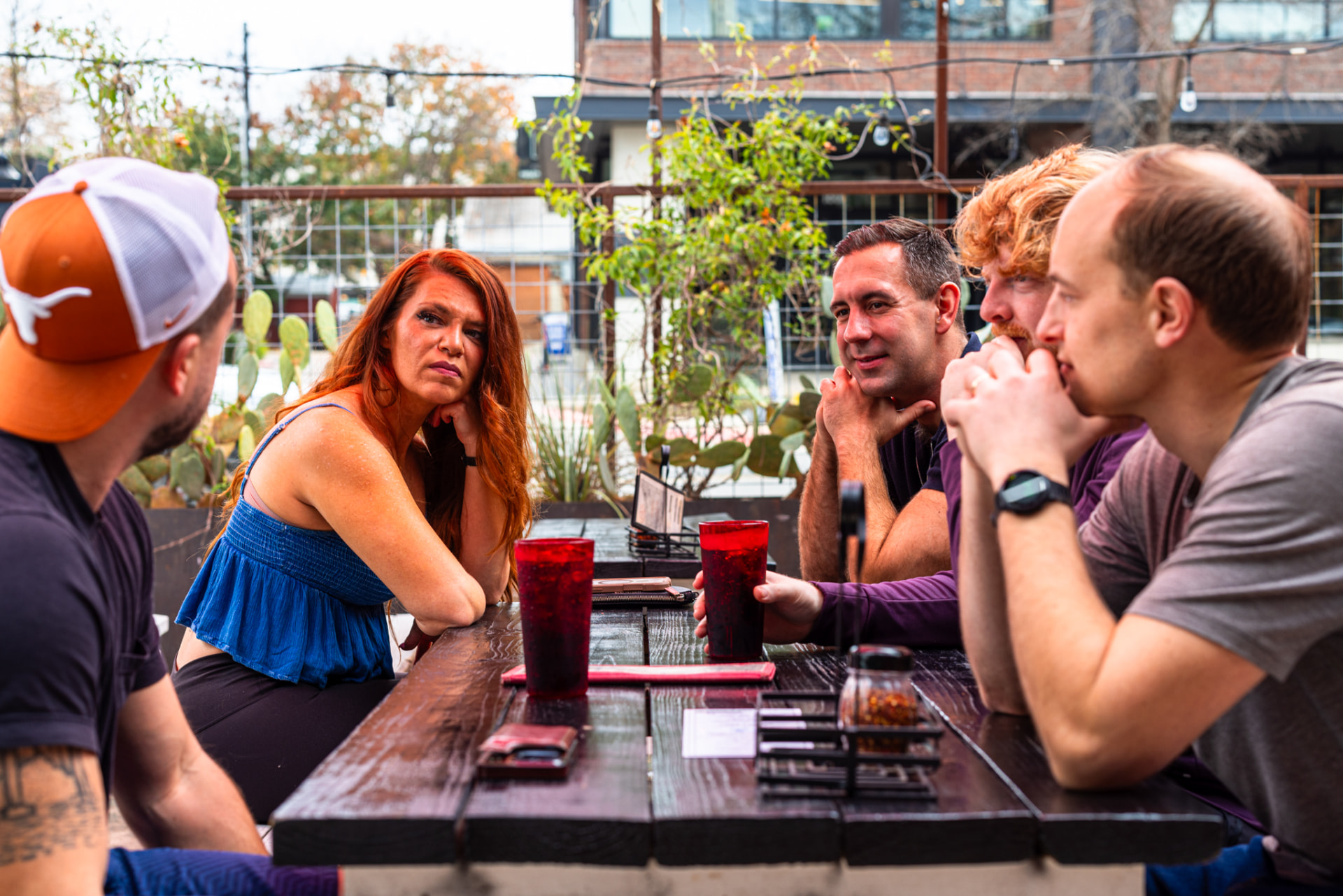 The group around an outdoor picnic table